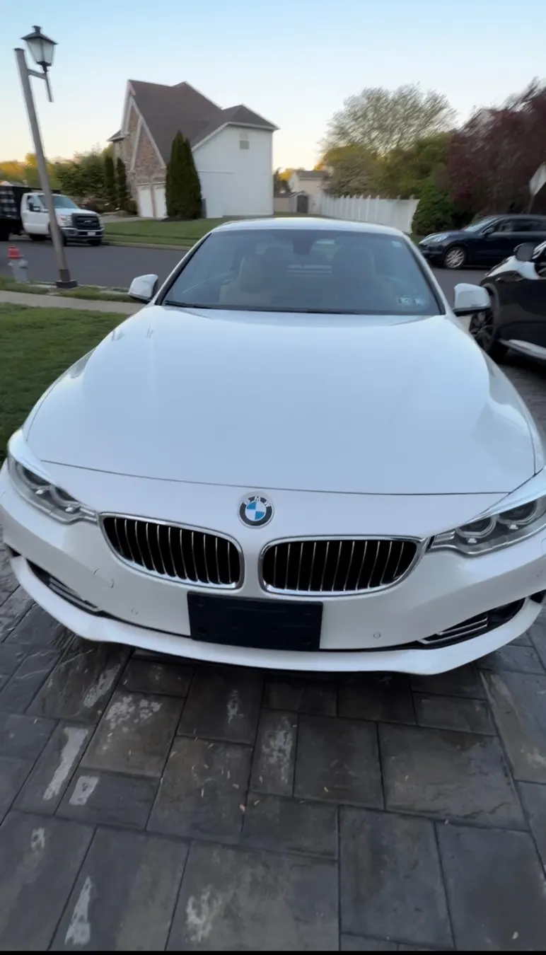 Front of a white BMW after a detail