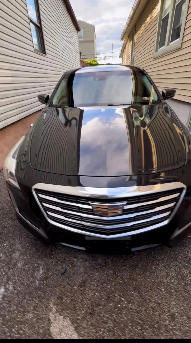 Shining hood of a black Cadillac