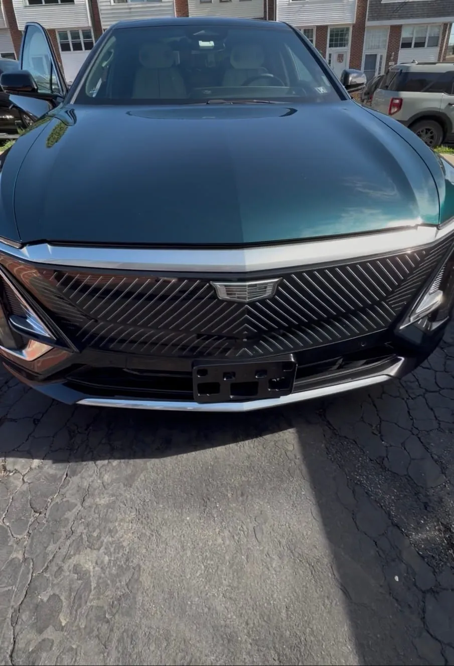 Front of a green Cadillac