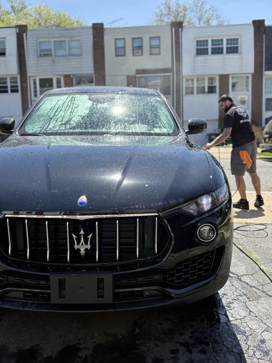 Washing a black Maserati SUV